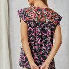 Top features a Round Neckline, Flutter Sleeves, and Floral Embroidery Throughout the Top