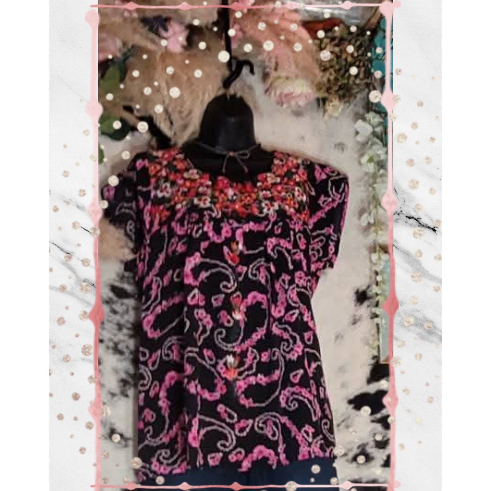 Top features a Round Neckline, Flutter Sleeves, and Floral Embroidery Throughout the Top