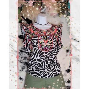 Print Cap Sleeve Top with Round Neckline and Relaxed Fit. Embroidery details on the front