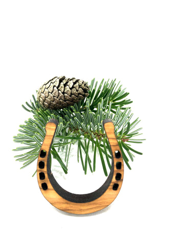Horseshoes as a Christmas tree pendant made of olive wood